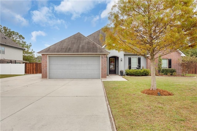 view of front facade with a front lawn and a garage