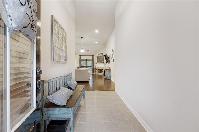 hallway with light hardwood / wood-style flooring