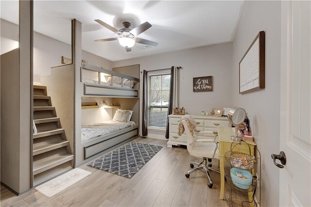 bedroom featuring light hardwood / wood-style floors and ceiling fan