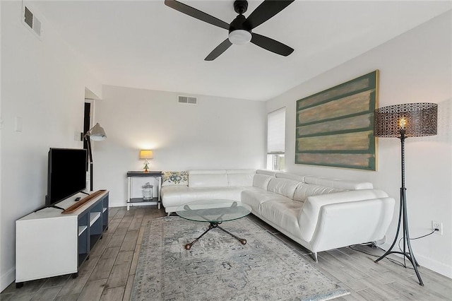 living room featuring ceiling fan