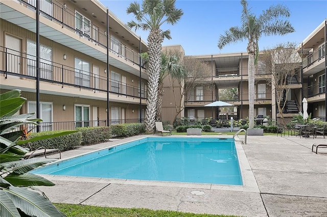 view of swimming pool with a patio