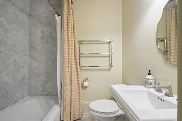 full bathroom featuring radiator heating unit, shower / bath combo, sink, and toilet