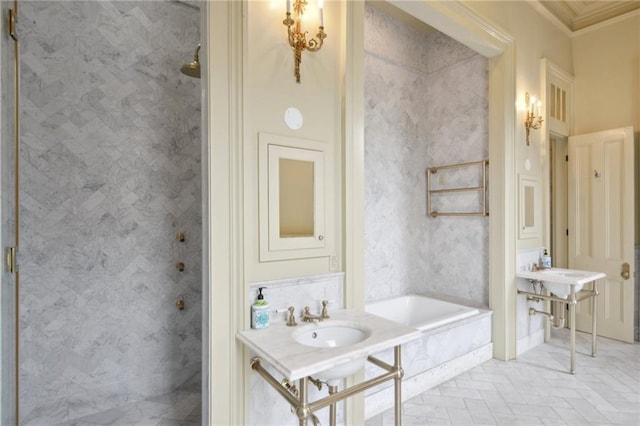 bathroom featuring ornamental molding, sink, and plus walk in shower