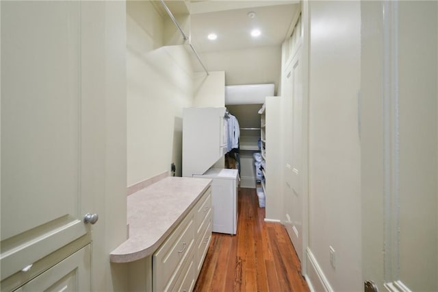 corridor with hardwood / wood-style floors