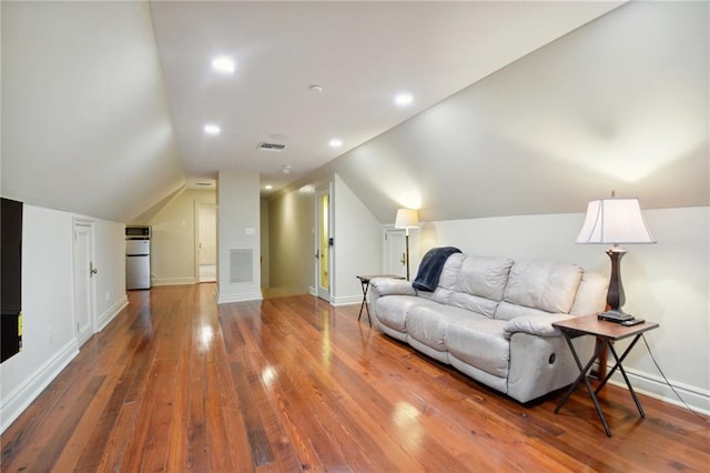 interior space featuring lofted ceiling and wood-type flooring