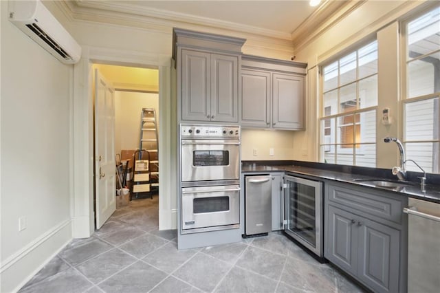 kitchen featuring appliances with stainless steel finishes, beverage cooler, ornamental molding, sink, and a wall unit AC