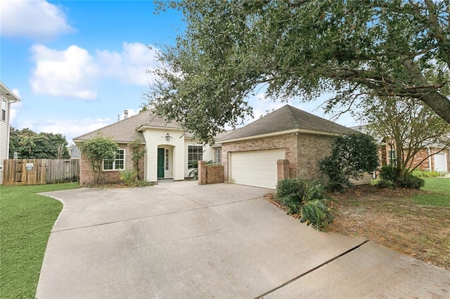 view of front facade with a front yard and a garage