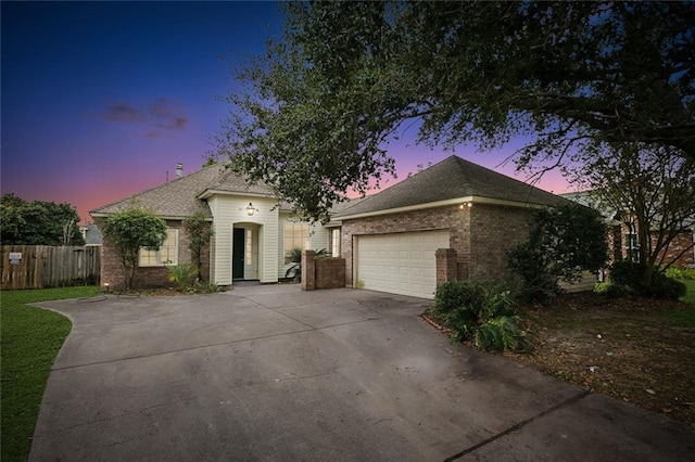 ranch-style house featuring a garage