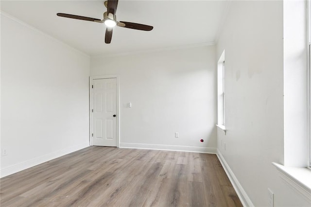 spare room featuring ceiling fan, ornamental molding, and light hardwood / wood-style flooring