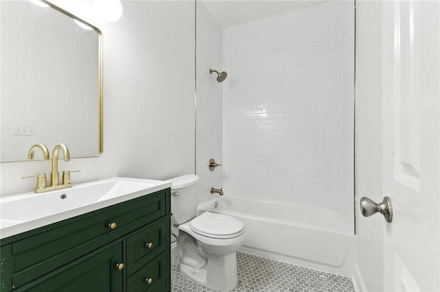 full bathroom featuring tile patterned floors, vanity, toilet, and tiled shower / bath combo