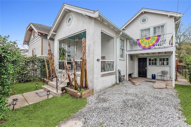 view of front of house with a balcony