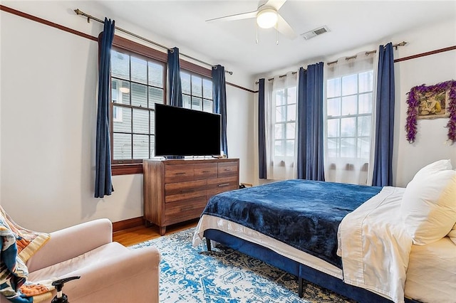 bedroom featuring hardwood / wood-style floors and ceiling fan