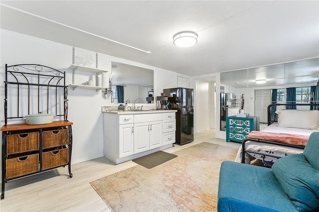 bathroom with hardwood / wood-style flooring and sink