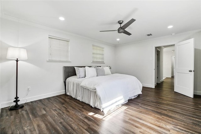 bedroom featuring ceiling fan, dark wood-type flooring, and ornamental molding