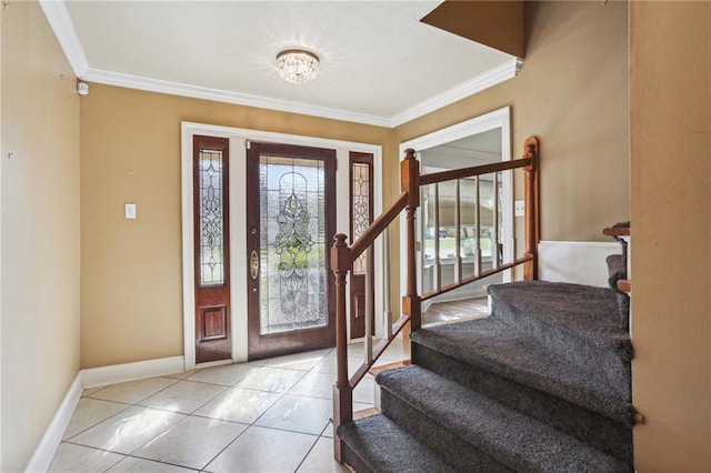 tiled foyer entrance featuring ornamental molding