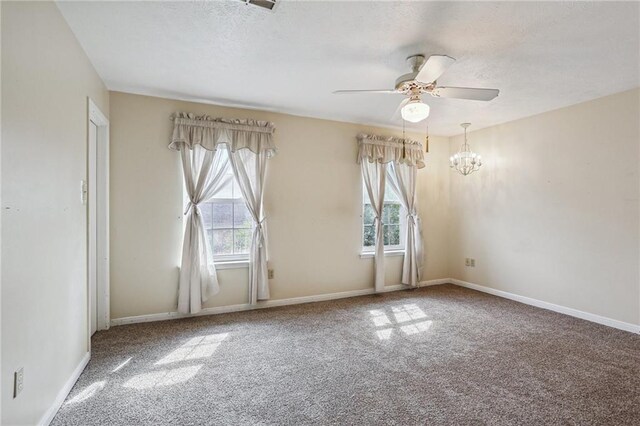 3733 Rockford Hts, Metairie, LA 70002 - carpeted spare room featuring ceiling fan with notable chandelier and a textured ceiling