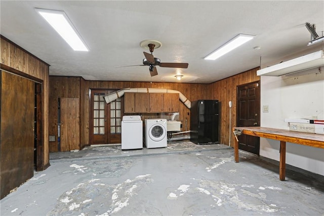 3733 Rockford Hts, Metairie, LA 70002 - garage featuring a workshop area, black fridge, ceiling fan, and wood walls