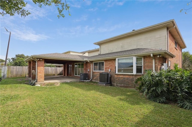 3733 Rockford Hts, Metairie, LA 70002 - rear view of property featuring brick siding, a patio area, and an attached carport