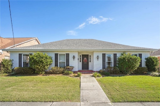 ranch-style house featuring a front yard