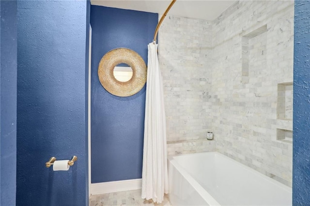 bathroom featuring shower / bathtub combination with curtain