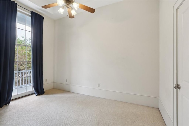 unfurnished room featuring ceiling fan and light carpet