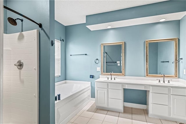 bathroom with a textured ceiling, vanity, separate shower and tub, and tile patterned flooring