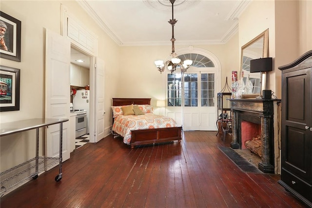 bedroom with an inviting chandelier, dark hardwood / wood-style floors, and ornamental molding