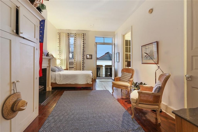 bedroom with dark wood-type flooring