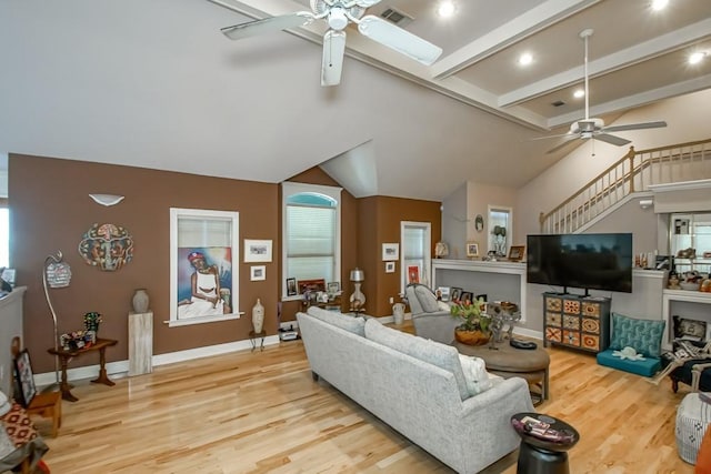 6300 W Metairie Ave, Metairie, LA 70003 - living room featuring ceiling fan, light wood-style floors, and stairs