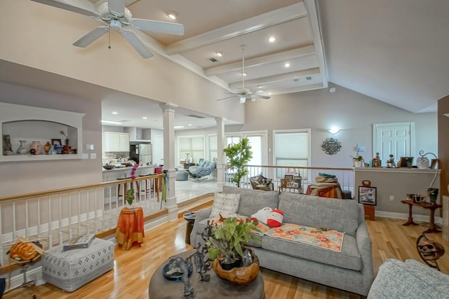 living room with beam ceiling, ceiling fan, high vaulted ceiling, and light hardwood / wood-style floors