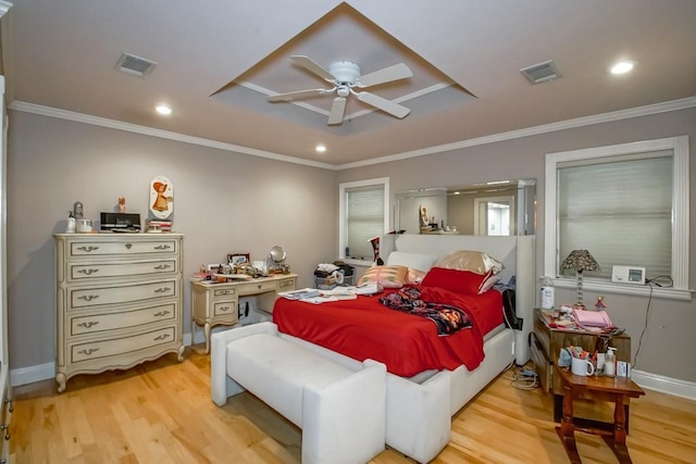 6300 W Metairie Ave, Metairie, LA 70003 - bedroom with light wood-style floors, ornamental molding, recessed lighting, ceiling fan, and a raised ceiling