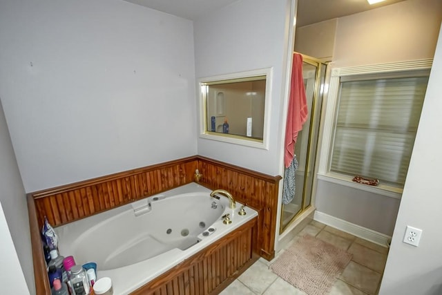 bathroom featuring plus walk in shower and tile patterned floors