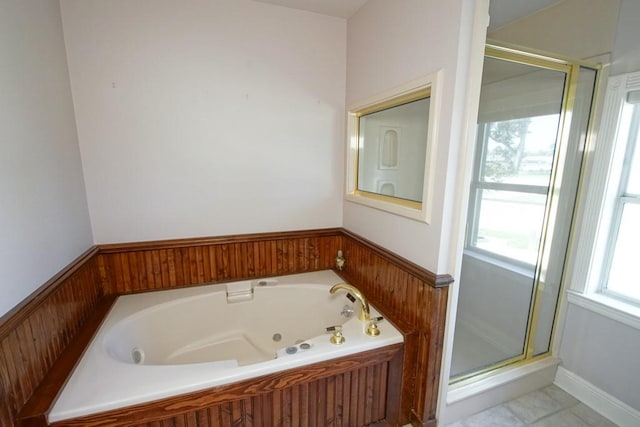 bathroom featuring shower with separate bathtub