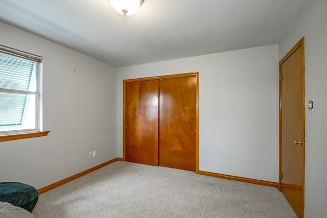 bedroom with a closet and carpet