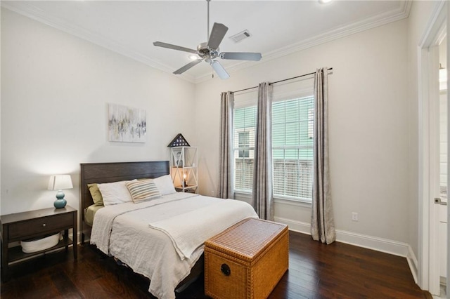 bedroom featuring ceiling fan, dark hardwood / wood-style flooring, and crown molding