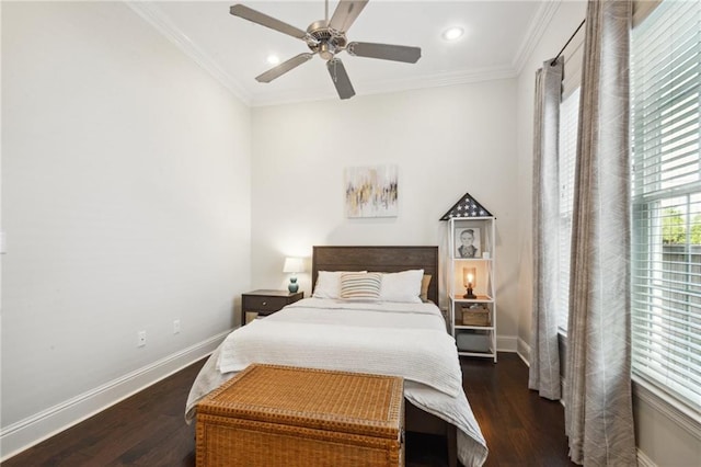 bedroom featuring ceiling fan, dark hardwood / wood-style floors, and ornamental molding