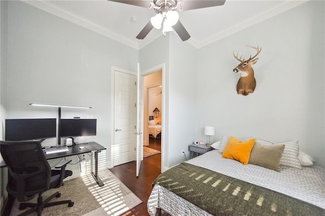 bedroom with ceiling fan, ornamental molding, and dark wood-type flooring