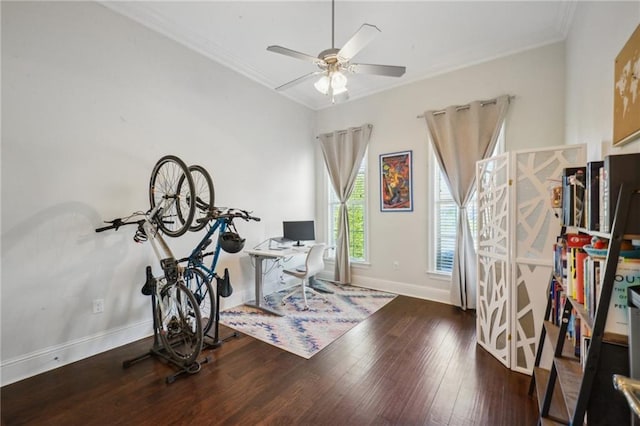 interior space with ceiling fan, ornamental molding, and dark wood-type flooring