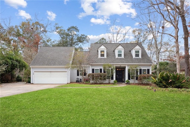 cape cod house featuring a garage and a front lawn