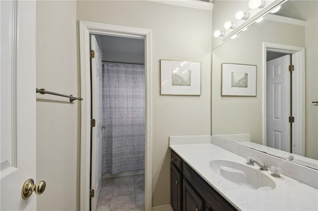 bathroom with a shower with curtain, vanity, and crown molding