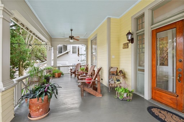 sunroom / solarium with ceiling fan