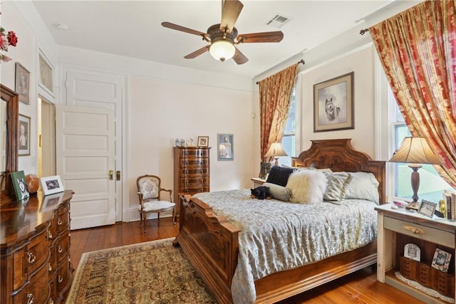 bedroom featuring hardwood / wood-style flooring and ceiling fan