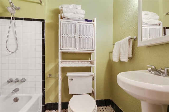 full bathroom featuring shower / bath combination, toilet, and sink