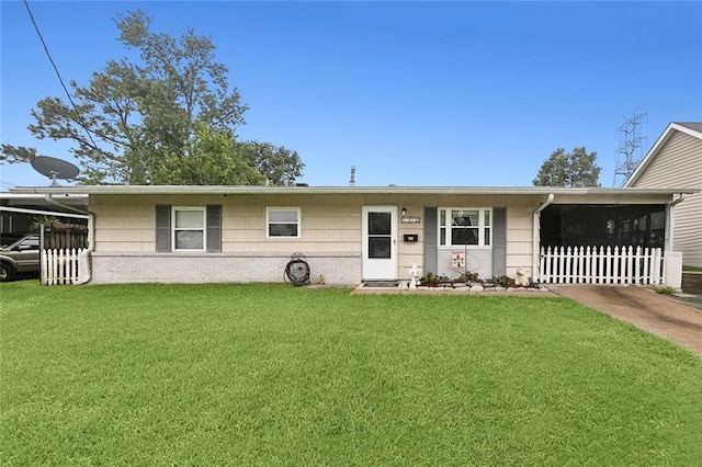 ranch-style house with a front lawn and a carport