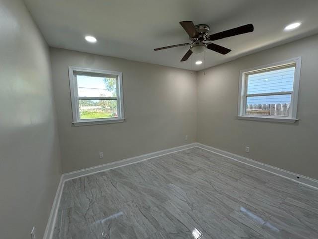 unfurnished room with ceiling fan