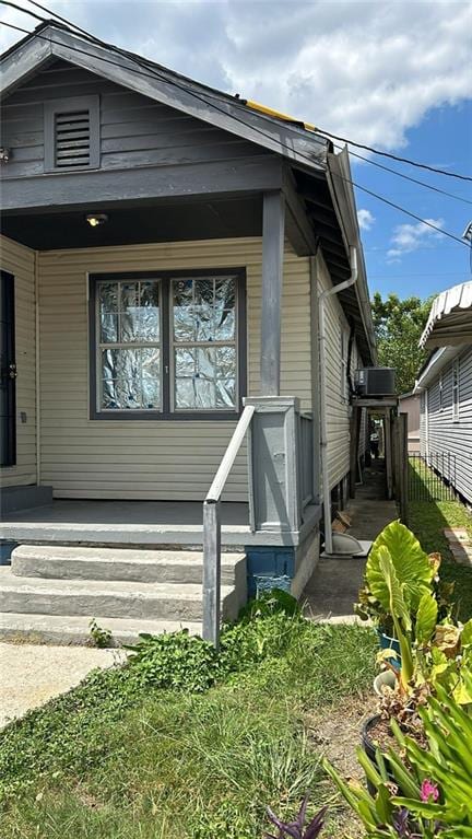 view of front of property featuring covered porch and central AC unit