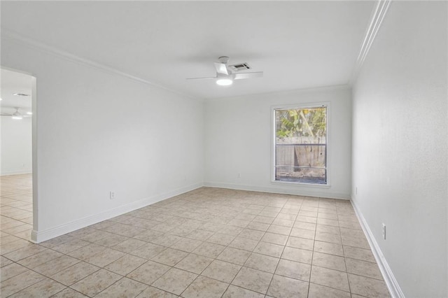 tiled spare room with ceiling fan and ornamental molding