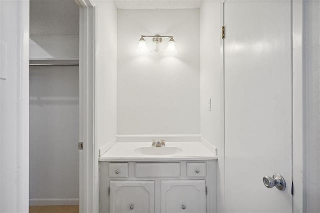 bathroom with vanity and a textured ceiling