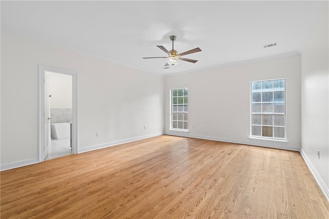 spare room featuring ceiling fan, light hardwood / wood-style floors, and ornamental molding