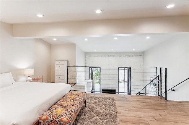 bedroom featuring recessed lighting and wood finished floors